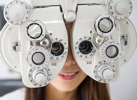 Woman getting eyes examined